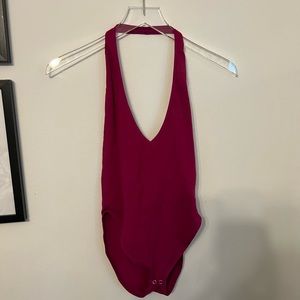 Pink body suit